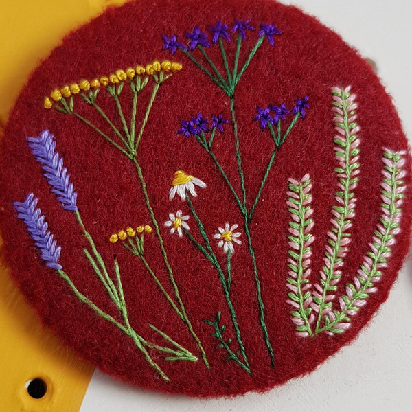 burgundy floral badge