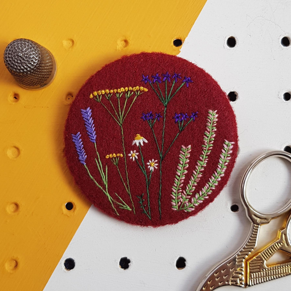 burgundy floral badge