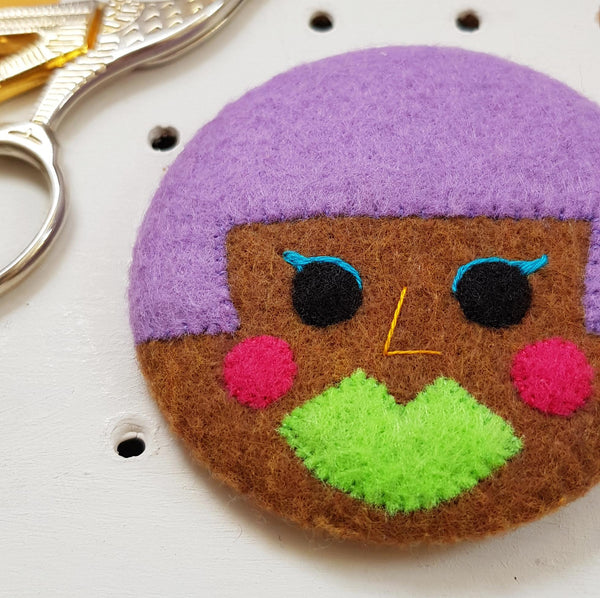 electro-pop face badge