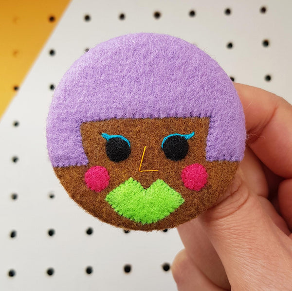 electro-pop face badge
