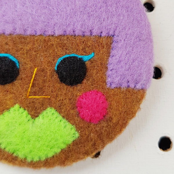 electro-pop face badge