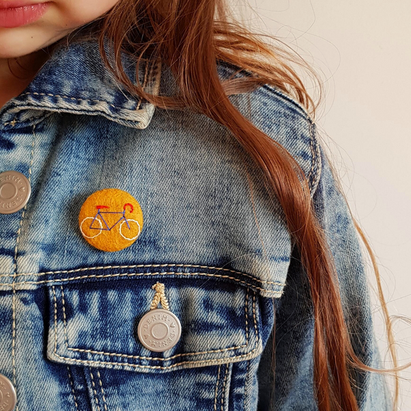 yellow bicycle badge