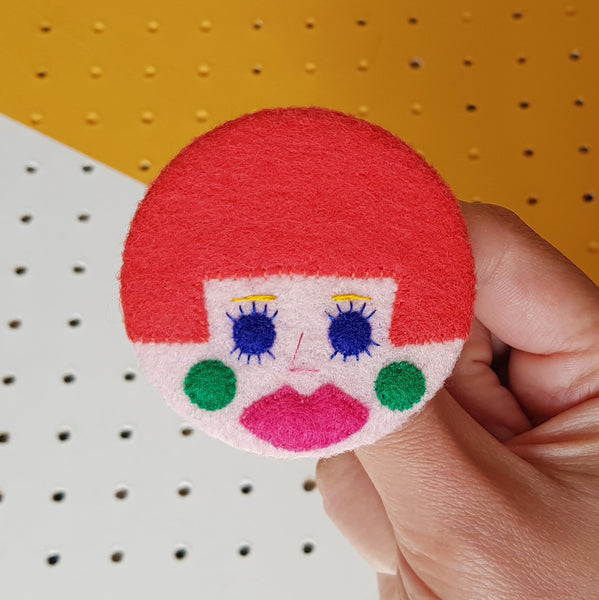 Coral pink hair badge