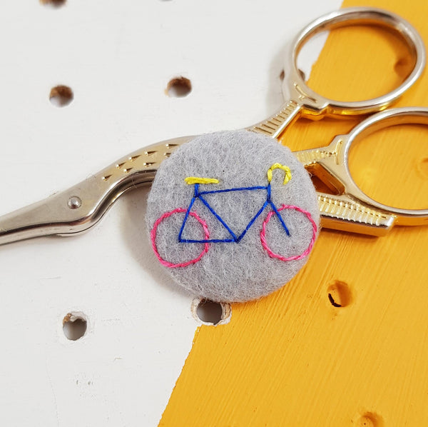 grey bicycle badge