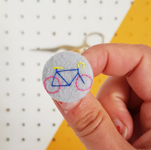 grey bicycle badge