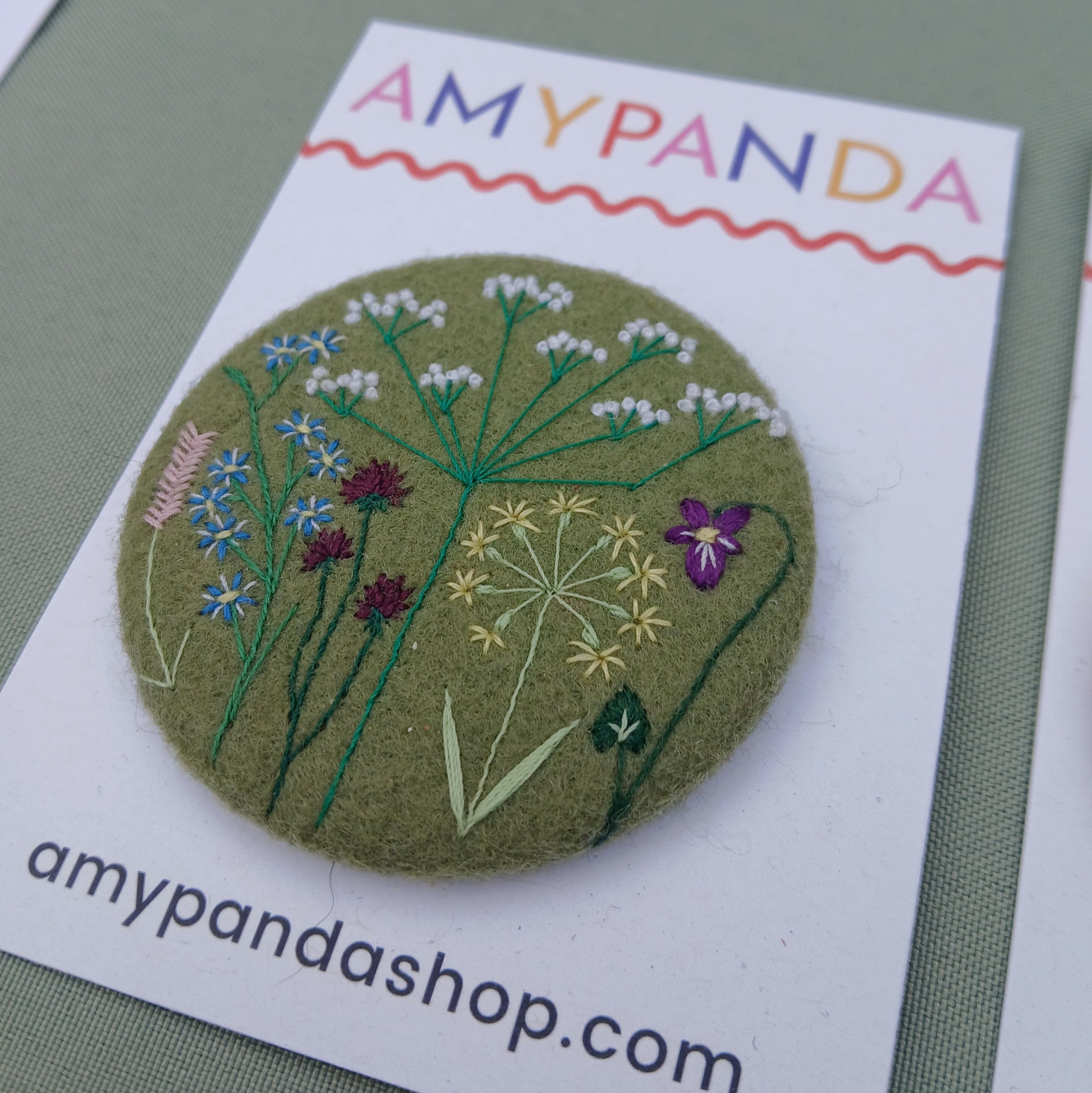 green wild flower badge - amypanda
