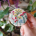 Brightly coloured floral badge