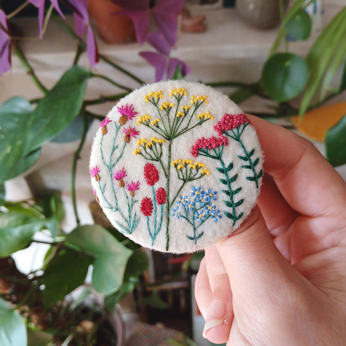 Brightly coloured floral badge