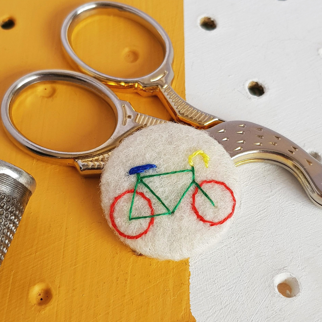 white bicycle badge - amypanda