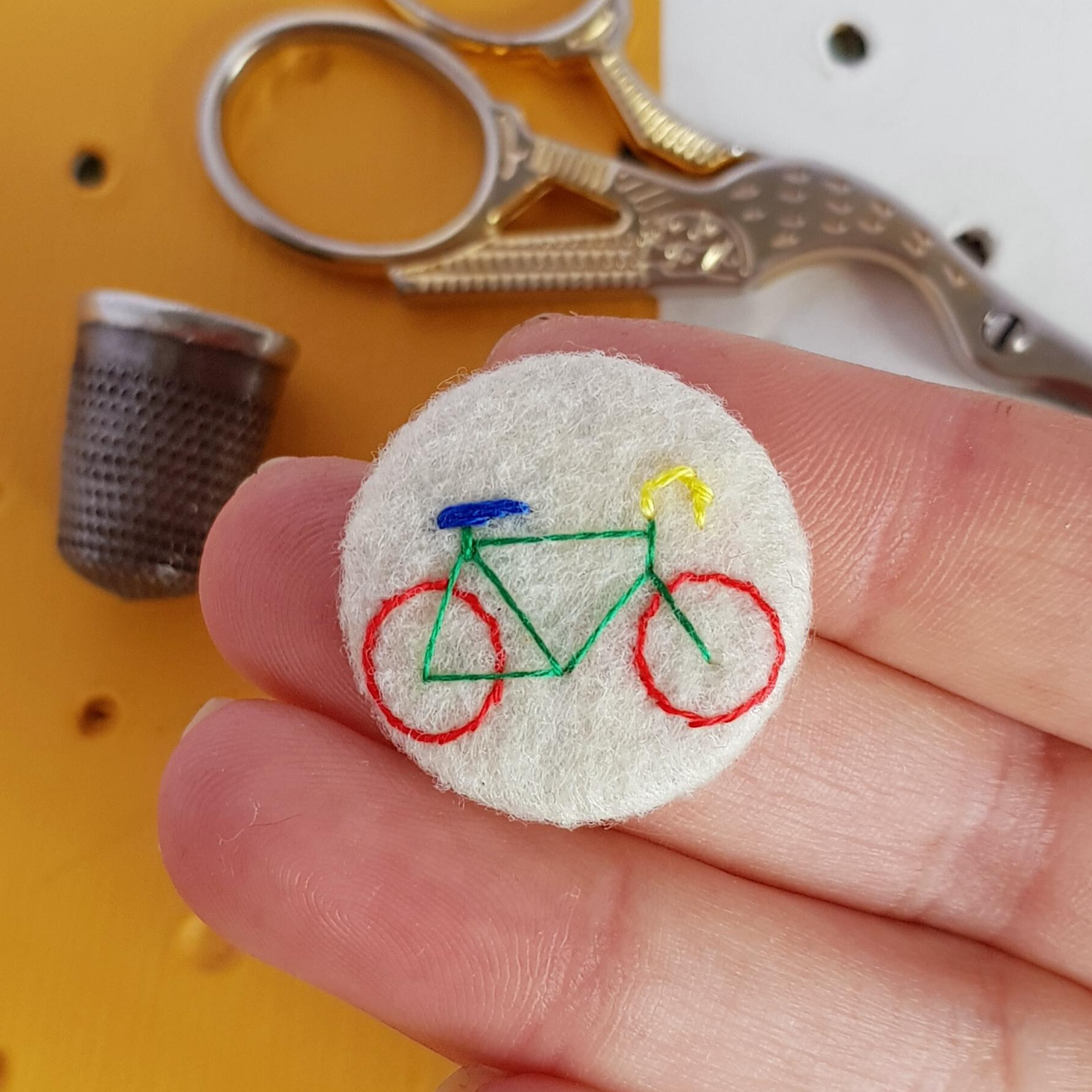 white bicycle badge - amypanda