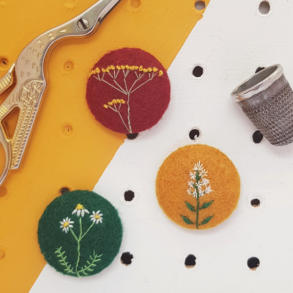 embroidered flowering herb badges