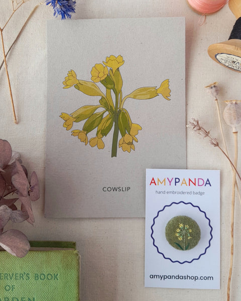 flower badge and illustrated postcard