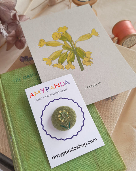 floral hand embroidered badge with illustrated postcard