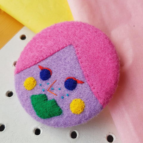 Lilac face badge
