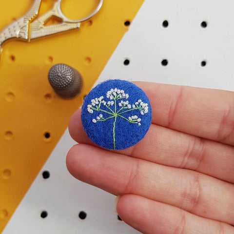 blue flower badge